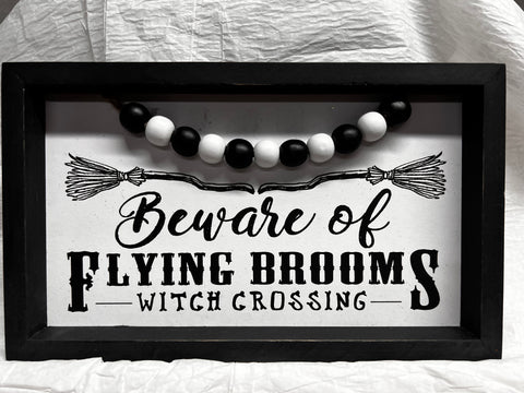 Flying Brooms Sign