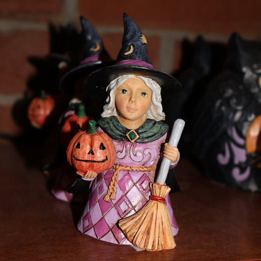 Witch Holding Pumpkin
